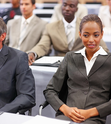 Happy young woman at a business conference