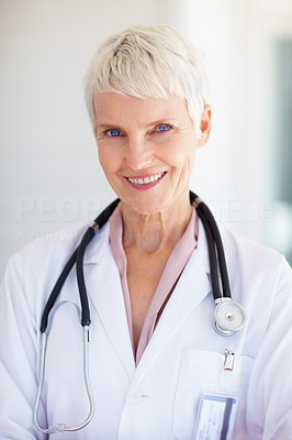 An old successful senior female doctor in uniform