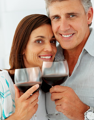 Closeup of a cute mature couple drinking a glass of wine together