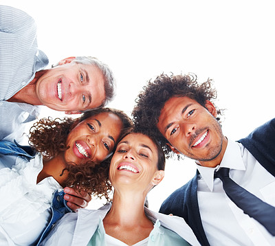 Upward view of business people standing together on a white background