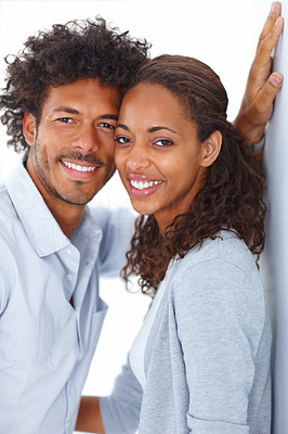 Portrait of an African American couple smiling together over white background