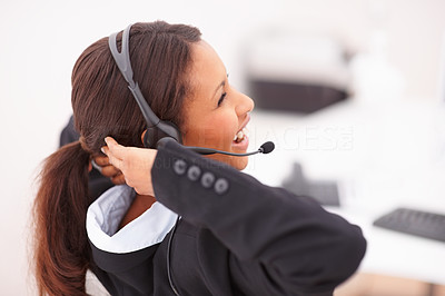 Relaxed young business woman with headset