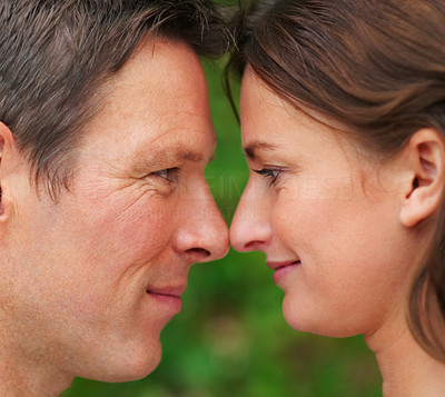 Closeup portrait of young couple with their faces close to eachother