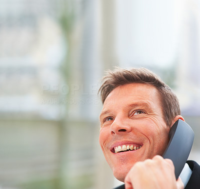 Closeup portrait of business man speaking on the phone looking upwards