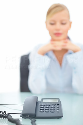 Blurred image of female waiting for a call over white background