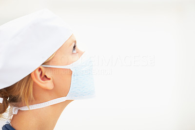 Closeup portrait of young lady surgeon wearing face mask