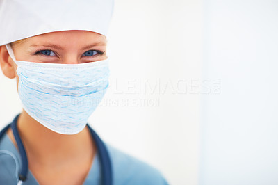 Closeup portrait of young lady surgeon over white background