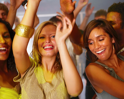 Closeup of young women dancing in a disco