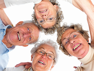 Group of old people with their heads together