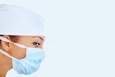Female doctor wearing surgical mask on white background