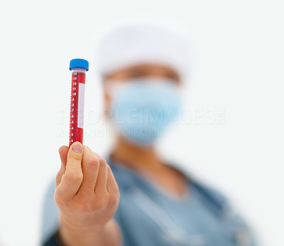 Female health professional looking at a blood sample