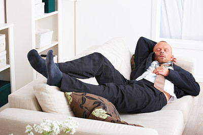 Stress - Tired business man sleeping on a sofa