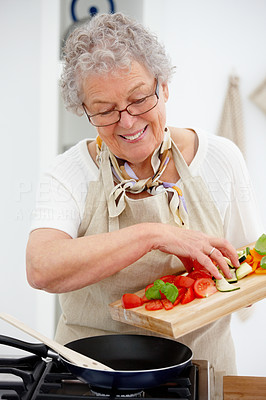 Grandma preparing a meal in the kitchen