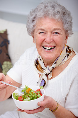 Closeup of an old woman sitting and having food