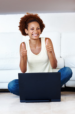 Woman making thumbs up gesture