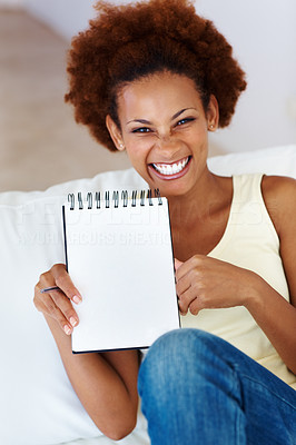 Woman showing blank notepad