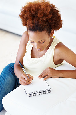 Woman writing down to do list