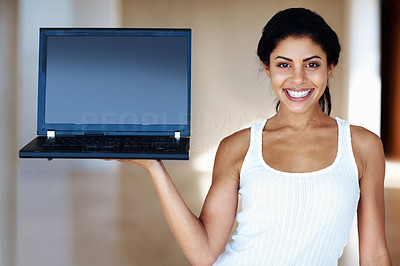 Woman displaying laptop