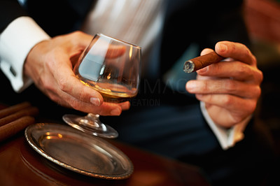 Wealthy man with cigar and cognac