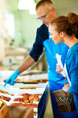 Female being shown food at a store