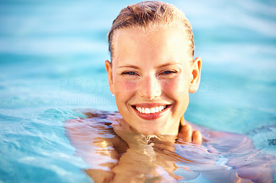 Smiling lovely woman in water