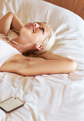 Relaxed young lady listening to music