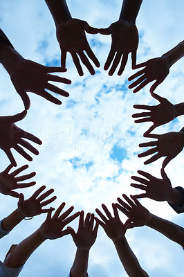 Vertical portrait of hands held in circle of unity