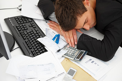 Top view of a business man sleeping on desk