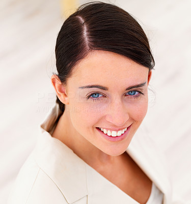 Closeup portrait of a young happy business woman on white background