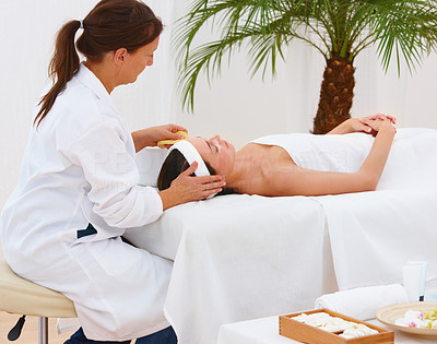 Mature female therapist working at a spa
