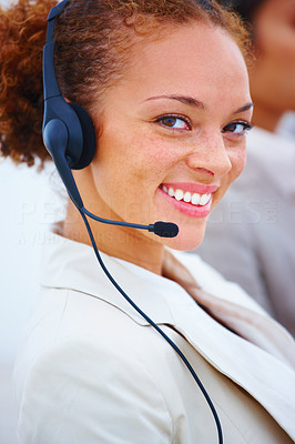 Closeup of a happy pretty executive with headset