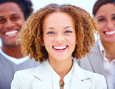 Portrait of a smiling business woman standing executives against white background