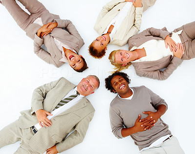 Portrait of happy business people lying on white