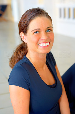 Smiling casual girl in a fitness center