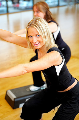 Women stepping in a fitness center