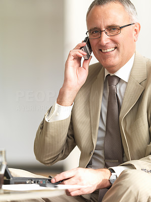 Senior business man using cell phone