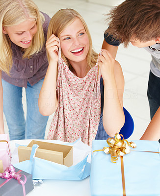 Woman showing gifts to her friends