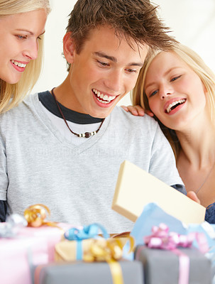 Boy with girls looking at gifts