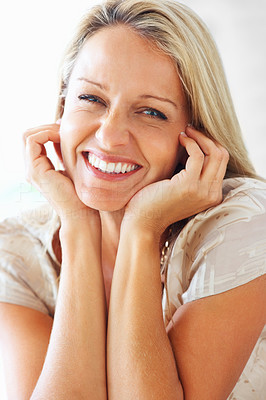 Mature happy woman giving you a cute smile