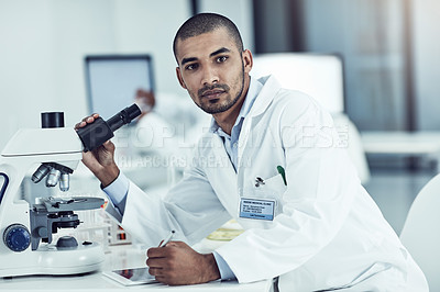 Buy stock photo Portrait of a scientist recording his findings on a digital tablet