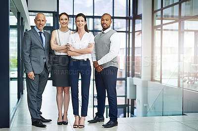 Buy stock photo Full length portrait of a group of businesspeople standing in the office