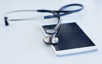 Buy stock photo Shot of a stethoscope and digital tablet on a table