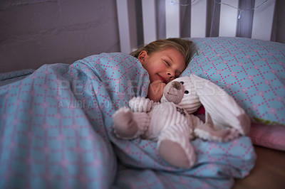 Buy stock photo Shot of a little girl sleeping in bed with her teddy bear