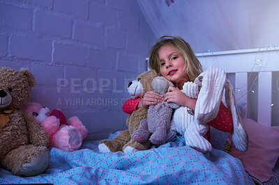 Buy stock photo Portrait of a little girl hugging her soft toys while sitting in bed