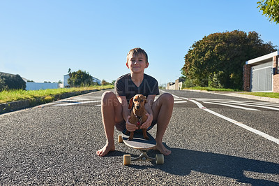 Buy stock photo Full length portrait of a young boy and his dog sitting on a longboard