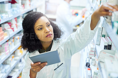 Managing her pharmacy with mobile apps