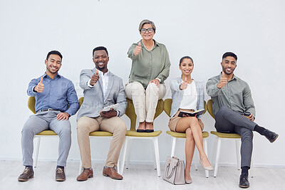 Buy stock photo Cropped studio shot of a group of businesspeople in line against a white background