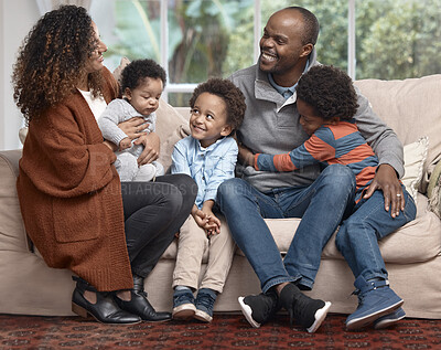 Buy stock photo Shot of a happy family relaxing on a sofa at home