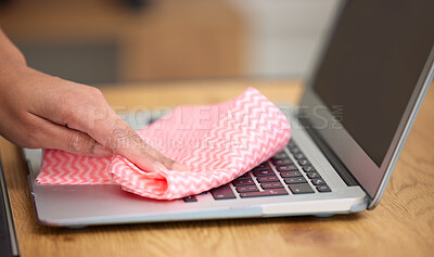 Buy stock photo Shot of a woman cleaning the dust from the laptop keyboard