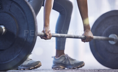Buy stock photo Closeup shot of an unrecognisable woman exercising with a barbell in a gym